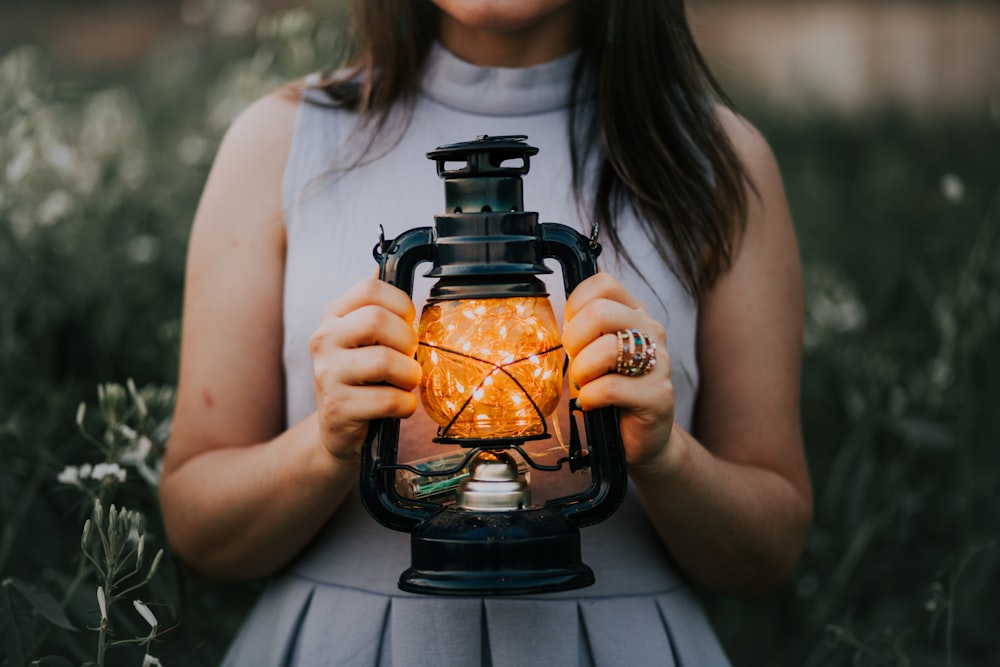 woman holding a lantern