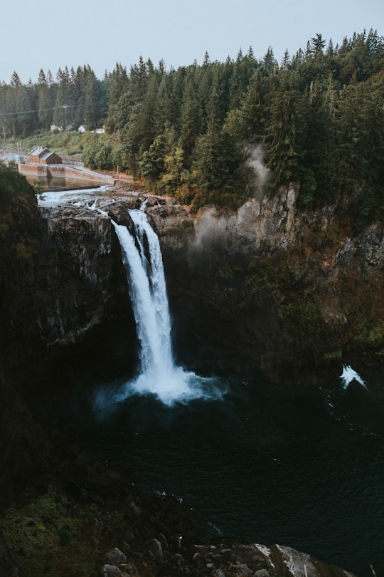 waterfall on brown rocks near forest in Snoqualmie Falls United States