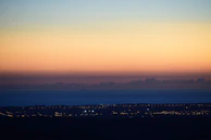 A serene landscape combining ukiyo-e style waves with neon city lights.