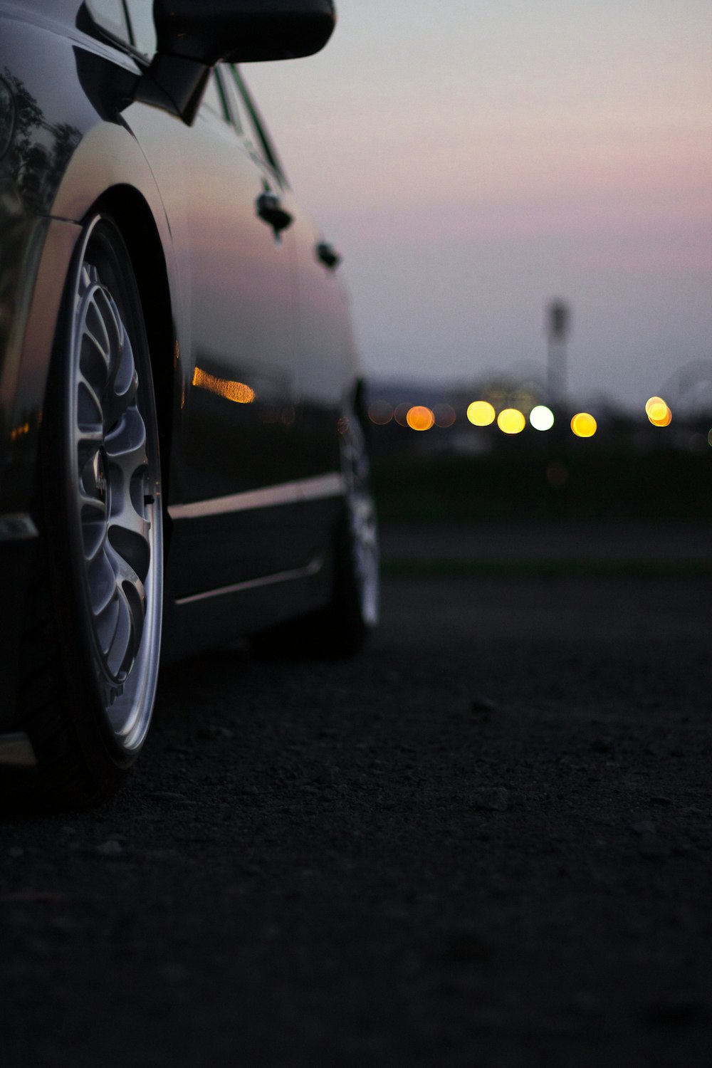 selective focus photography of black car