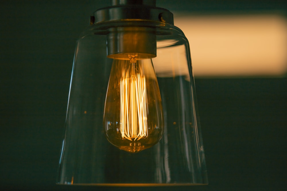 shallow focus photography of incandescent bulb