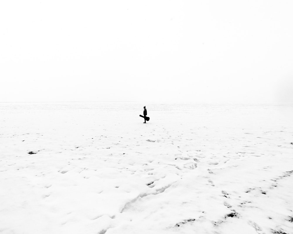 photo of man holding guitar