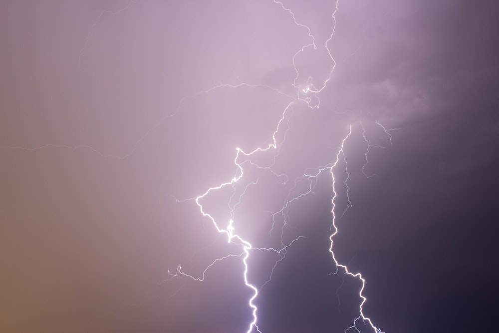 lightning strikes under cloudy storm