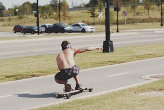 man riding longboard