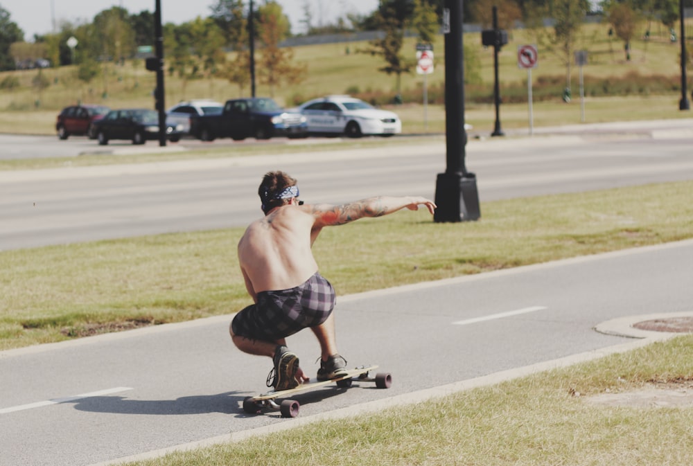 man riding longboard