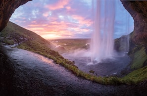A sunset over the Iguazu Falls showcasing its majestic beauty.