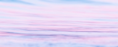 a blurry photo of a pink and blue sky