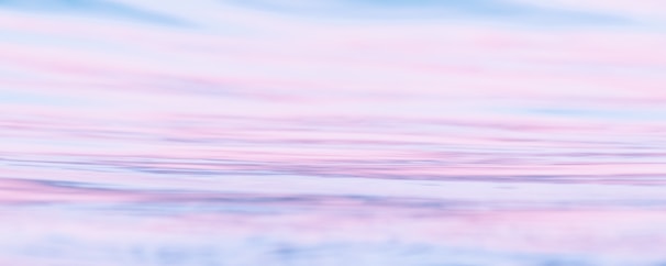 a blurry photo of a pink and blue sky