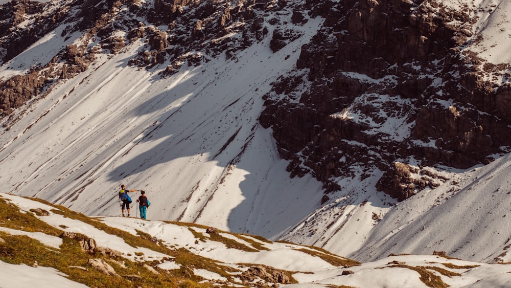 two women standing on snow-covered mountain