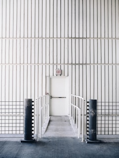 architectural photography of exit door with bridge