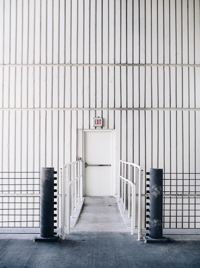 architectural photography of exit door with bridge