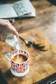 blue, red, and white mug filled with coffee