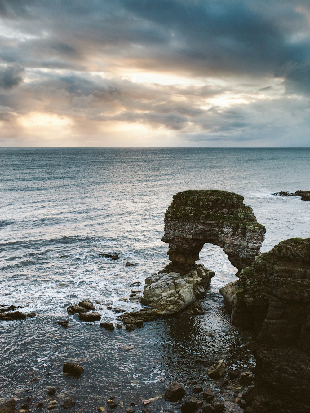 rock formation on body of water