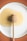 honey dipper on round plate with honey