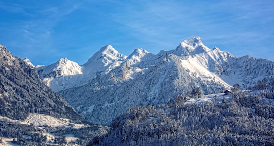 mountain covered with snow under blue sky in Sarnen Switzerland