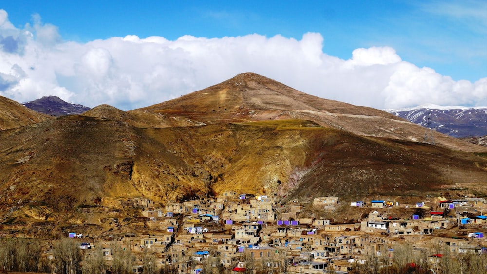 photo of houses near hill