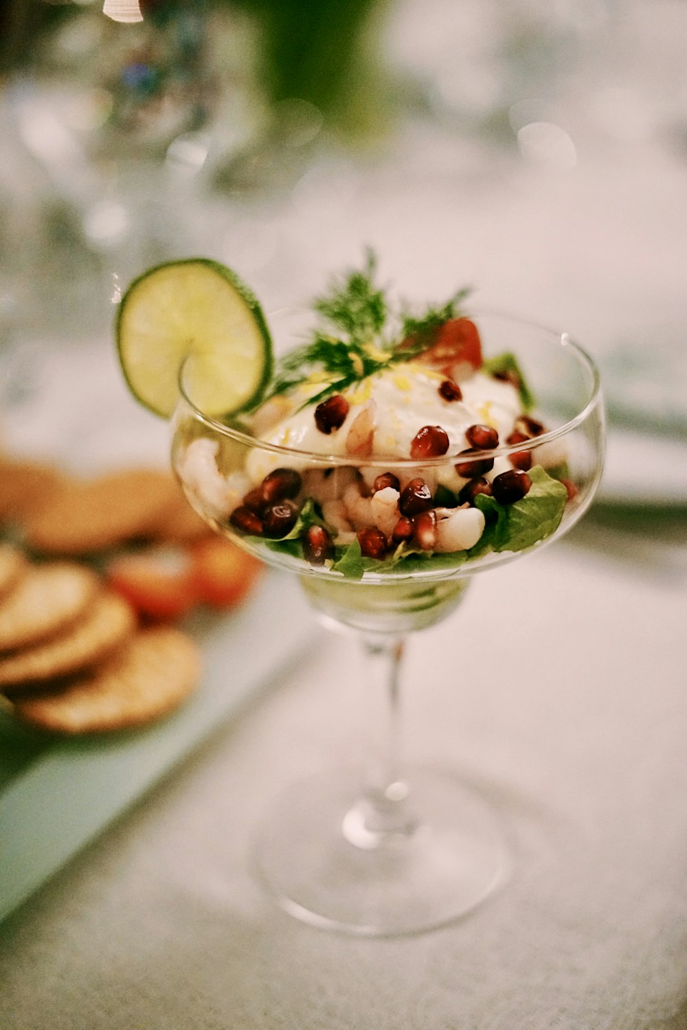 shallow focus photography of martini glass with slice of lemon