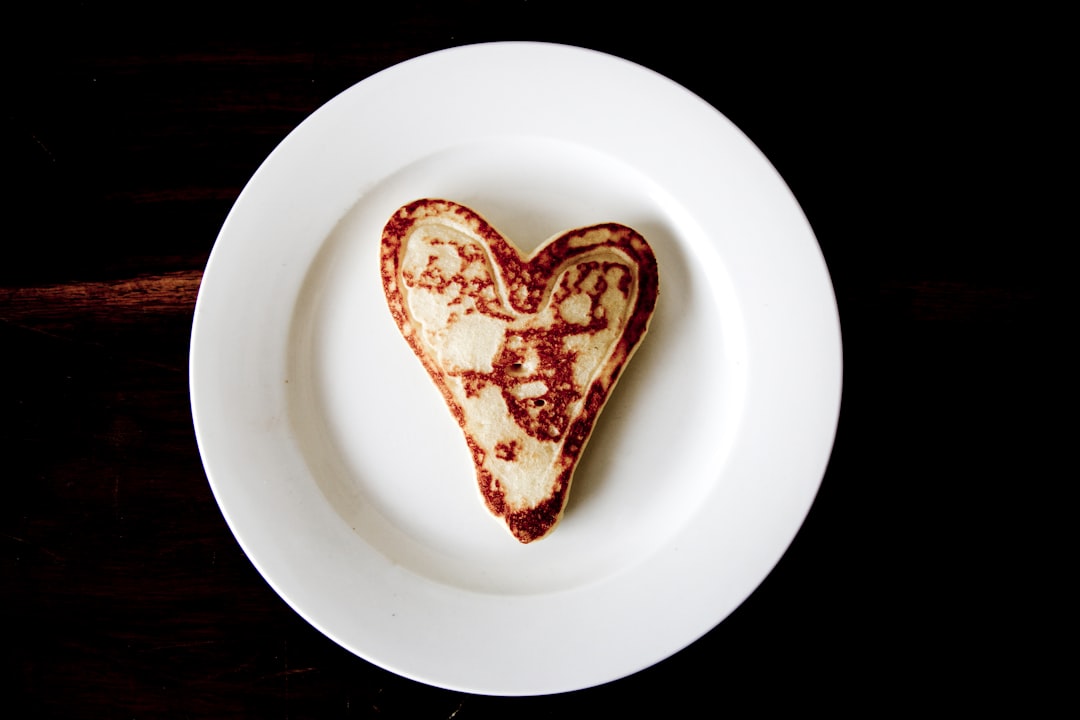 heart-shaped toasted bread on round white ceramic plate