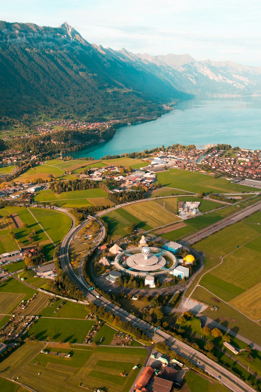 an aerial view of a town and a lake