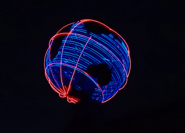 Animated globe with glowing neon lines connecting USA, India, and Australia representing maak infosoft’s global network.