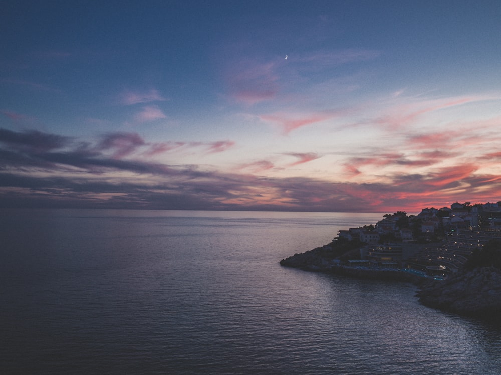 white houses near seashore