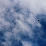 plane flying near clouds