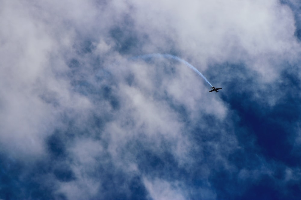 plane flying near clouds