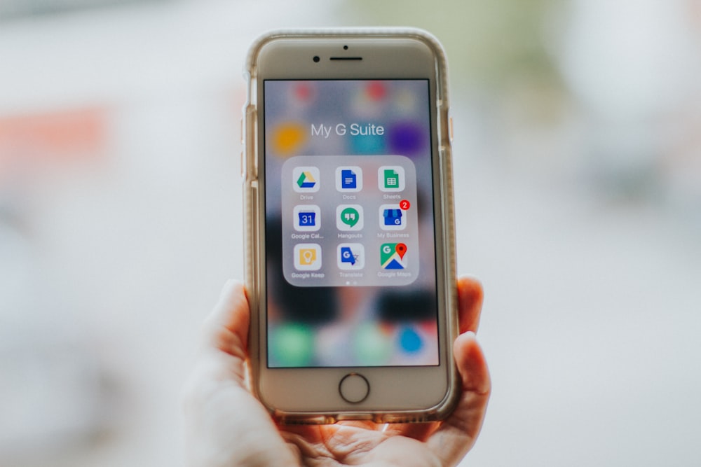 person holding silver iPhone 6