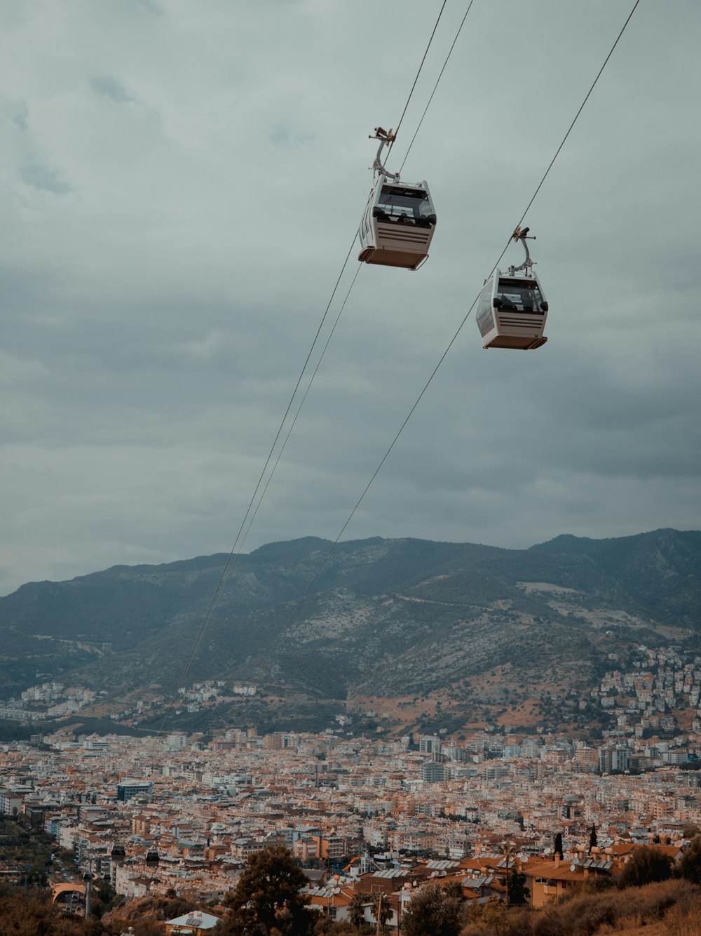 low angle photography of two white cable carts