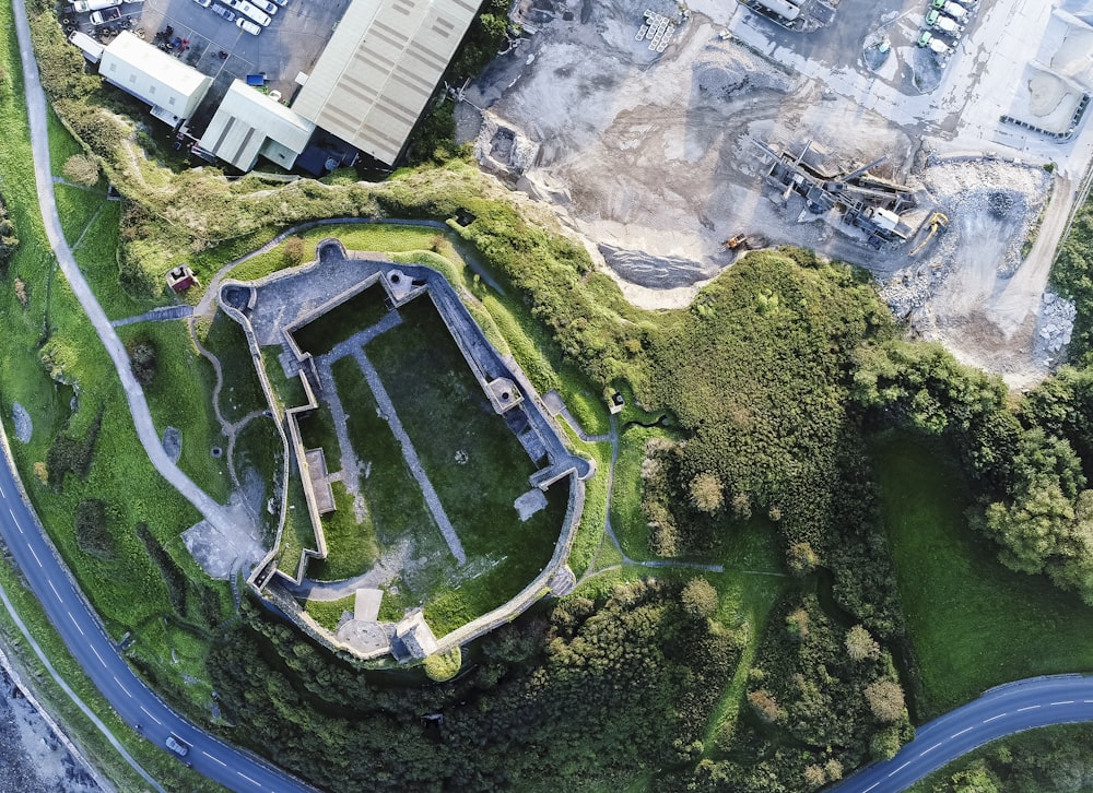 aerial view of green grass field near establishments