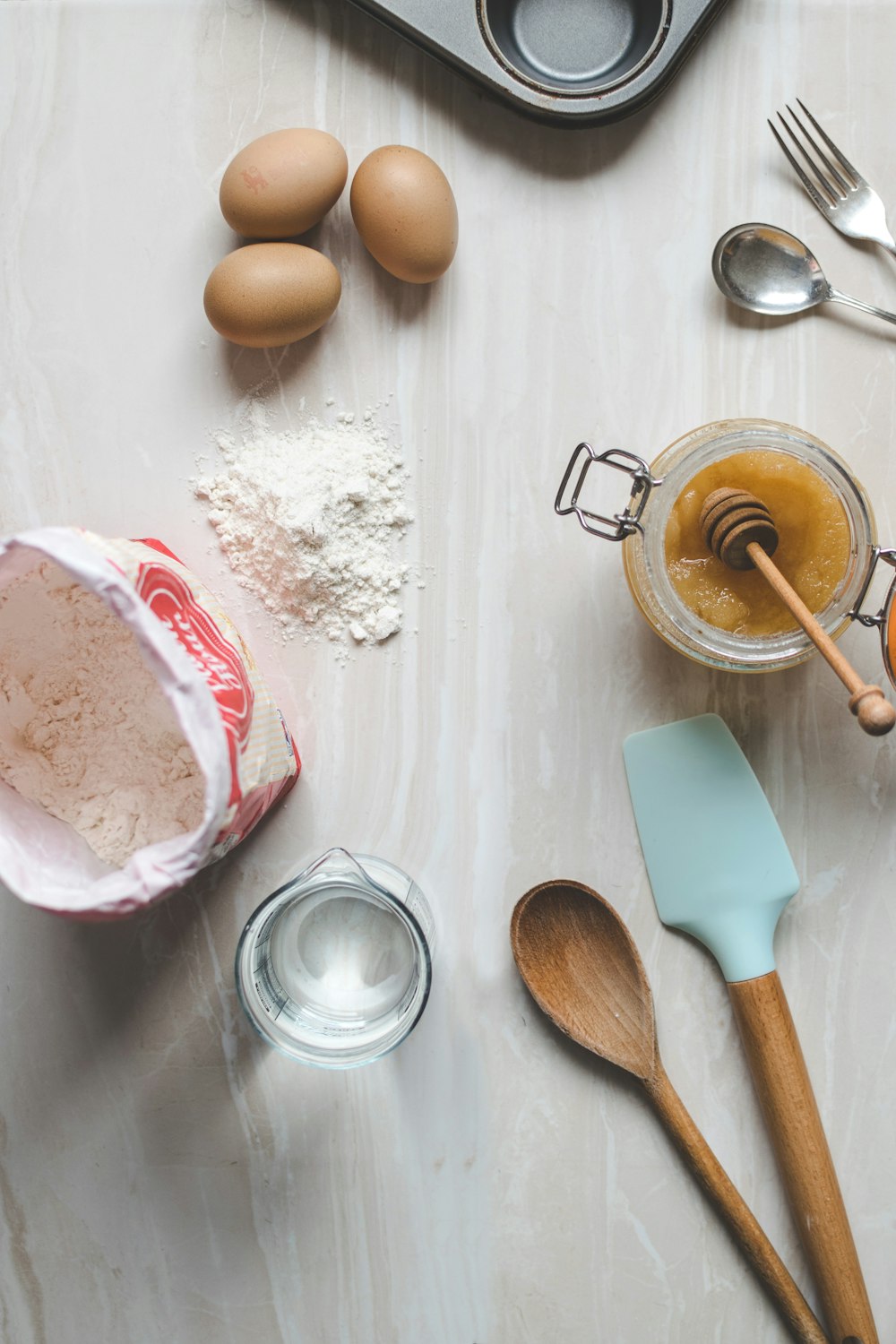 wooden ladle and spatula on top of table