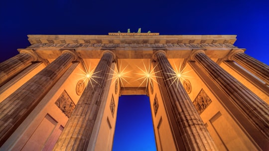 concrete arch under blue sky in Brandenburg Gate Germany