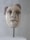 A marble sculpture of a human face with intricate details, depicting strong facial features and a neutral expression. The sculpture rests on a cylindrical stand and has a partially damaged nose. The hair is carved with fine lines to add texture, and the overall finish gives a sense of antiquity.