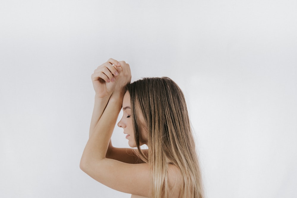 photo of posing blonde-haired woman