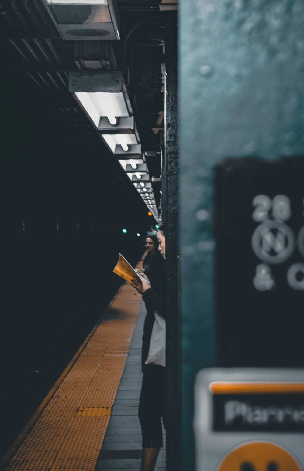 two women standing in front of train