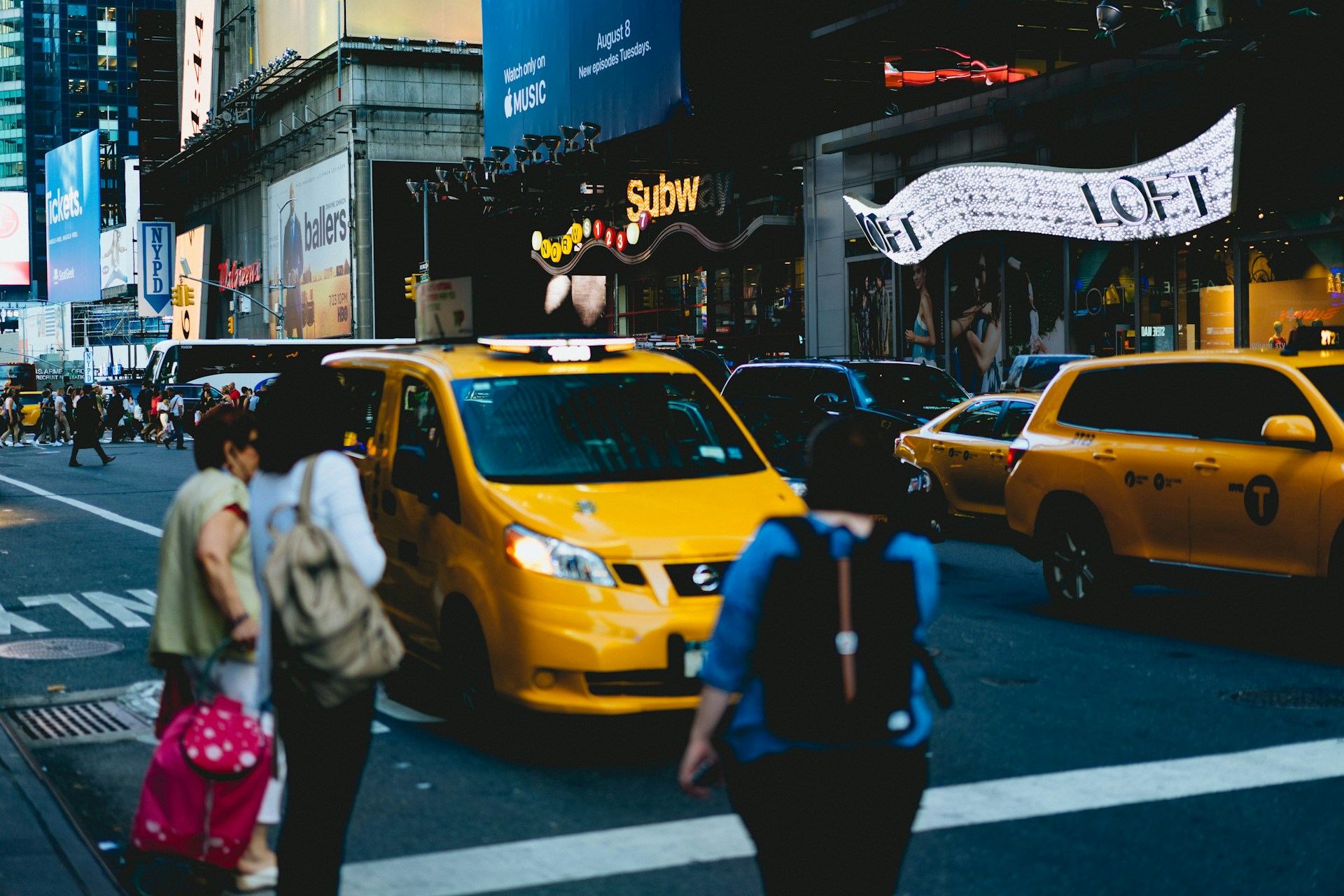 persons standing on pedestrian lane