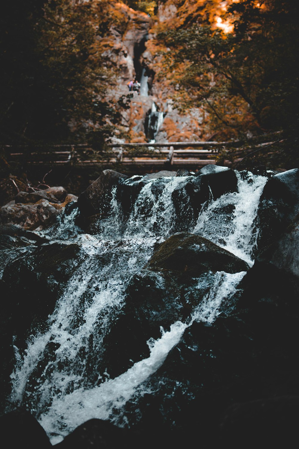 photo of water rushing down through stone