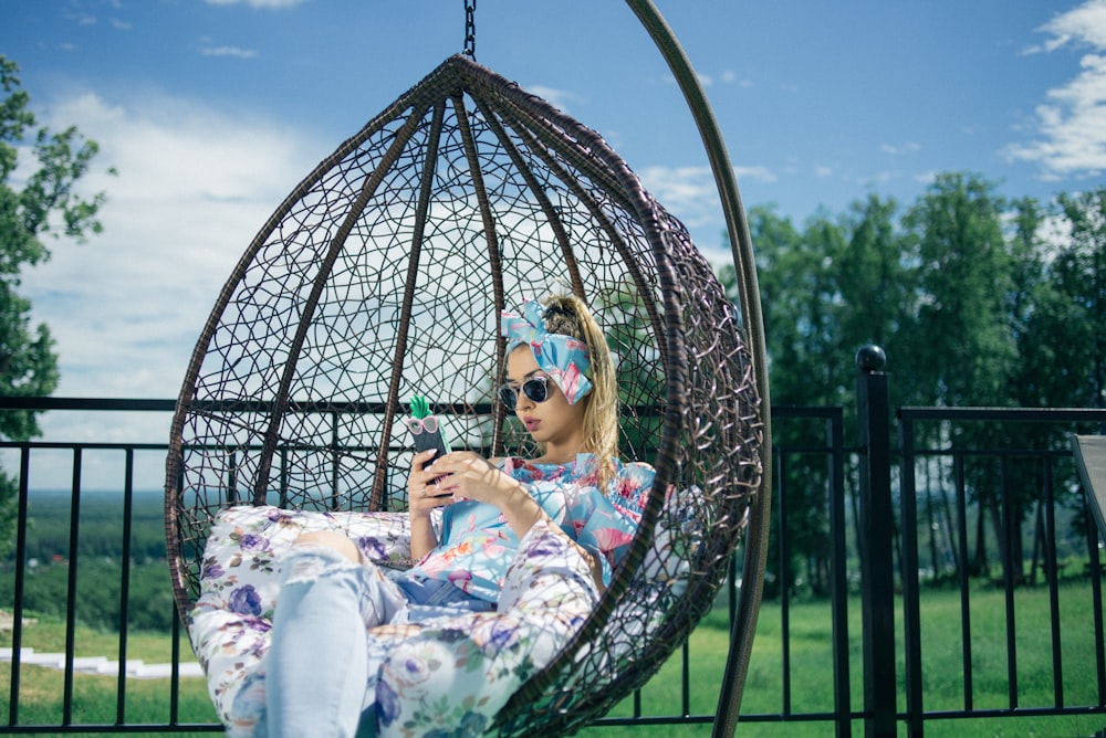 woman on black hanging chair