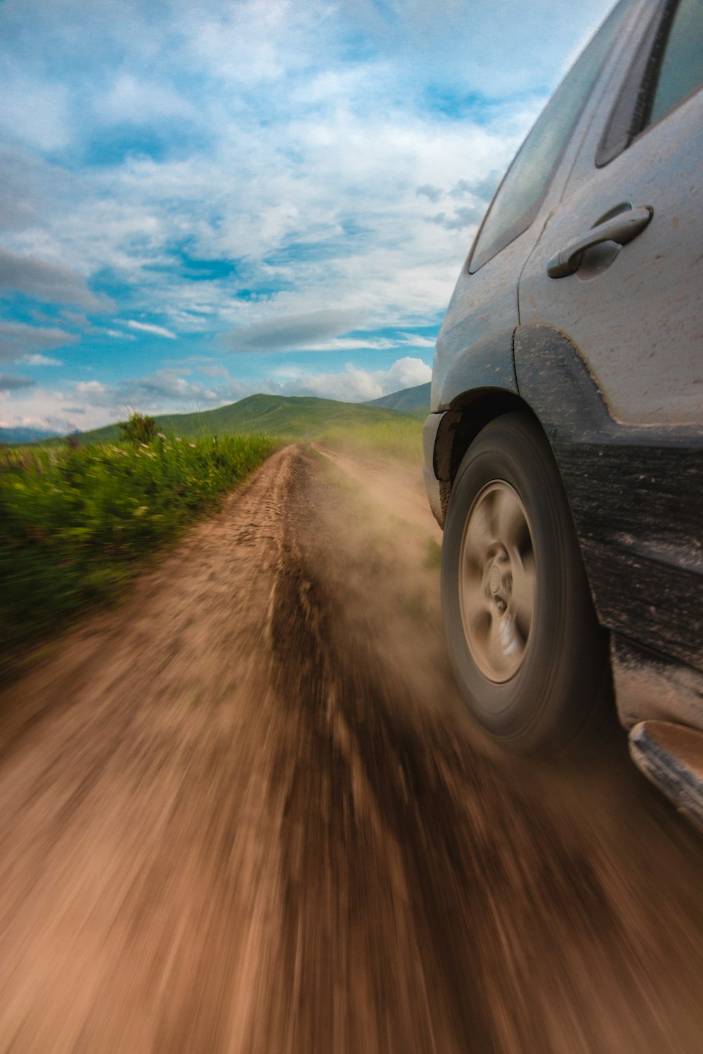 gray car near green grass field