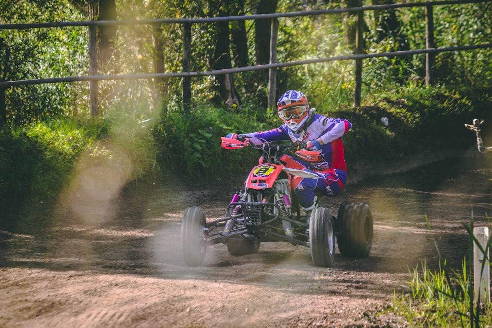 person riding ATV on rough road