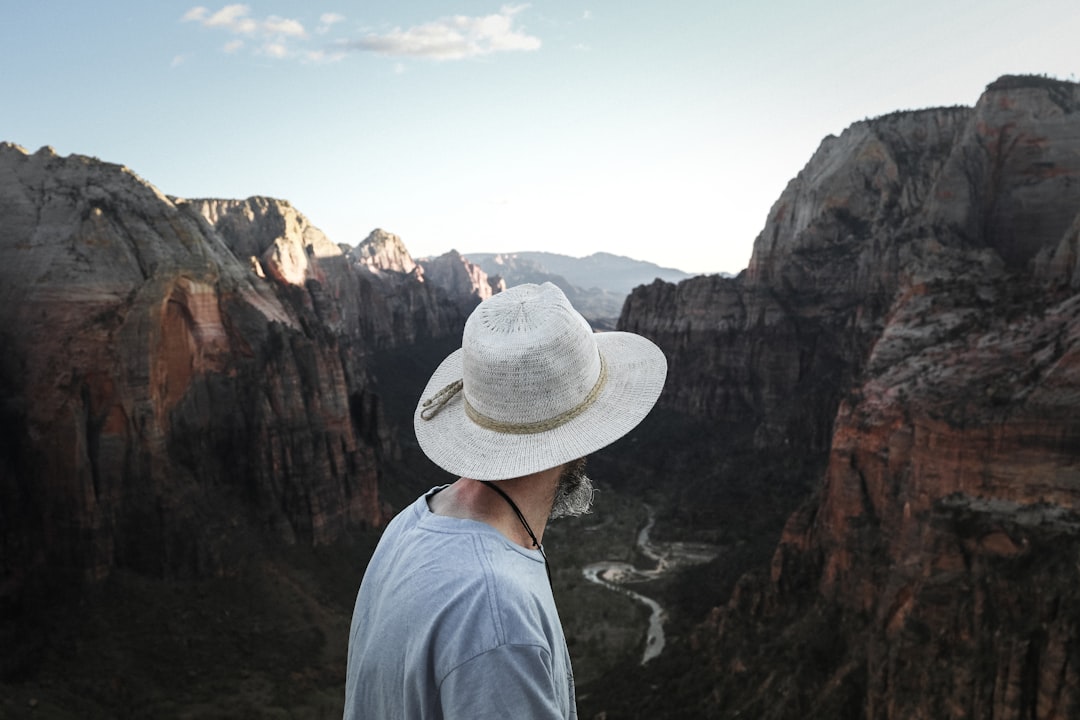 person looking on rock mountain during daytime