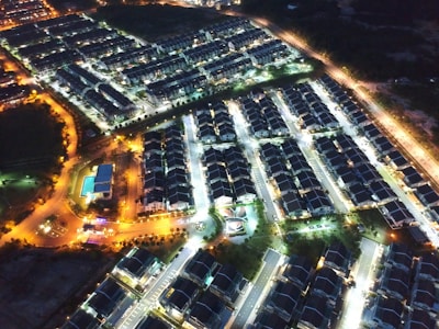 Night view of a well-lit residential neighborhood.