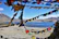 A serene mountain valley with colorful prayer flags fluttering in the breeze.