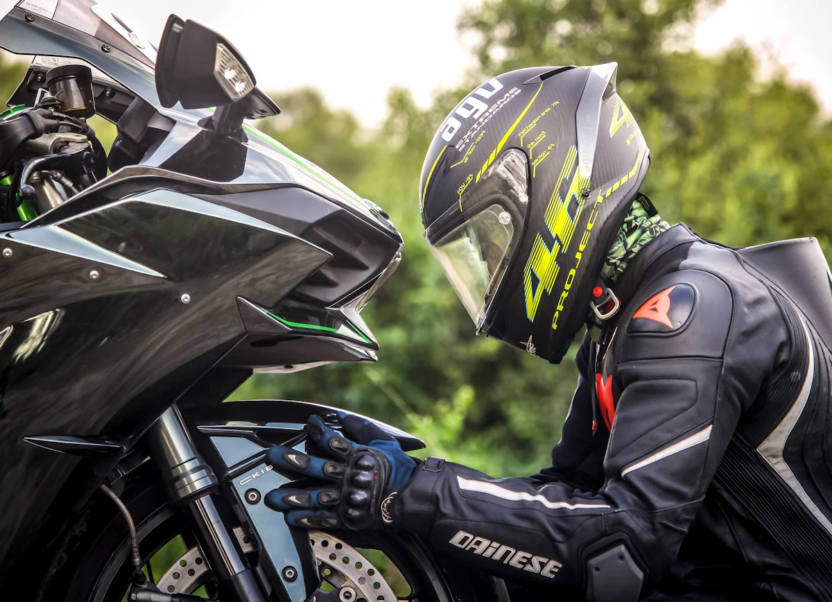 Two motorcyclists riding with helmets