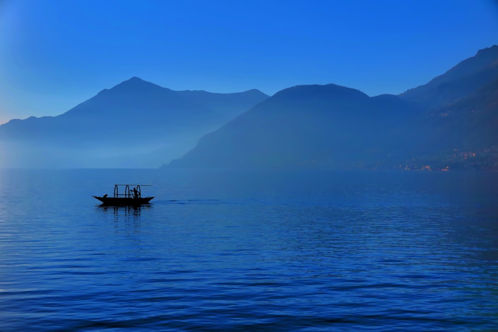 black boat in body of water