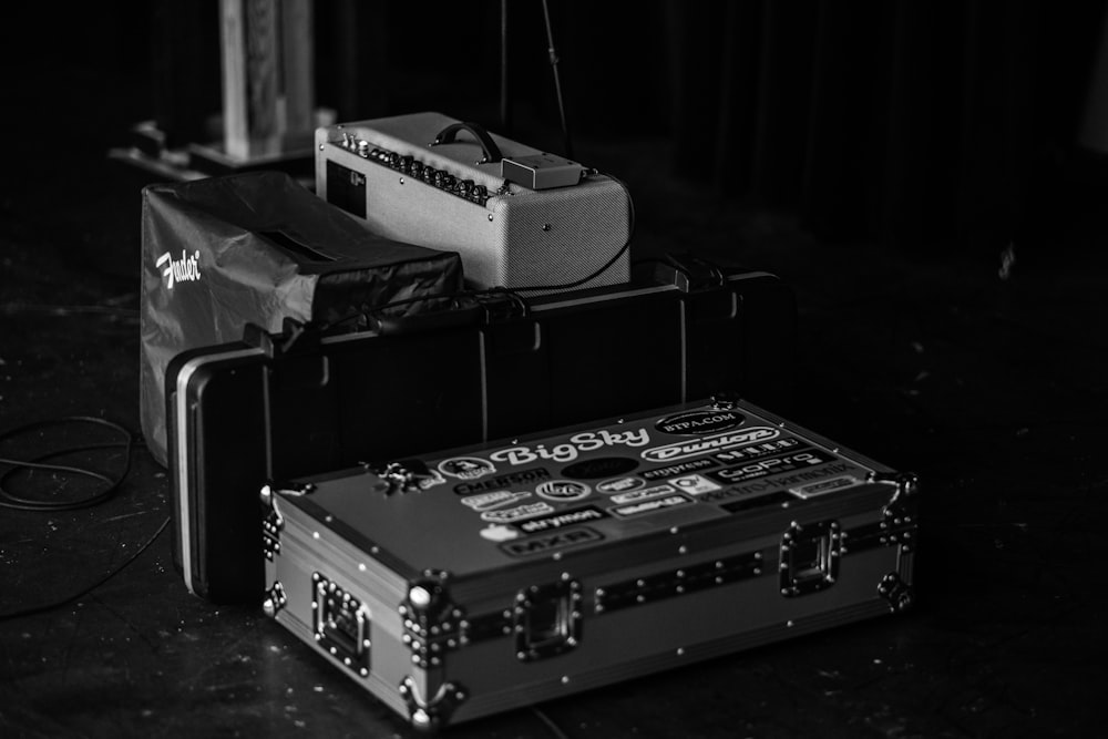 grayscale photography of suitcase