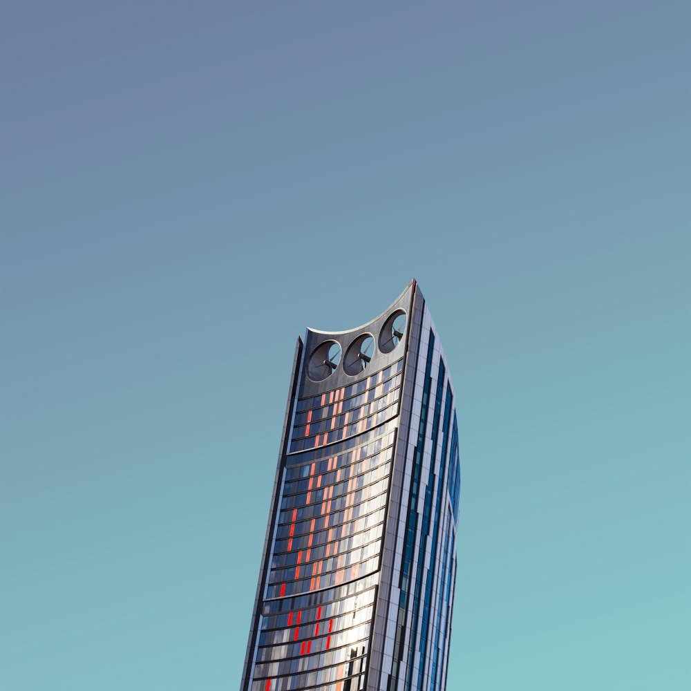 a tall building with a clock on the top of it