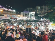 A bustling Phuket night market filled with colorful stalls and lively crowds.