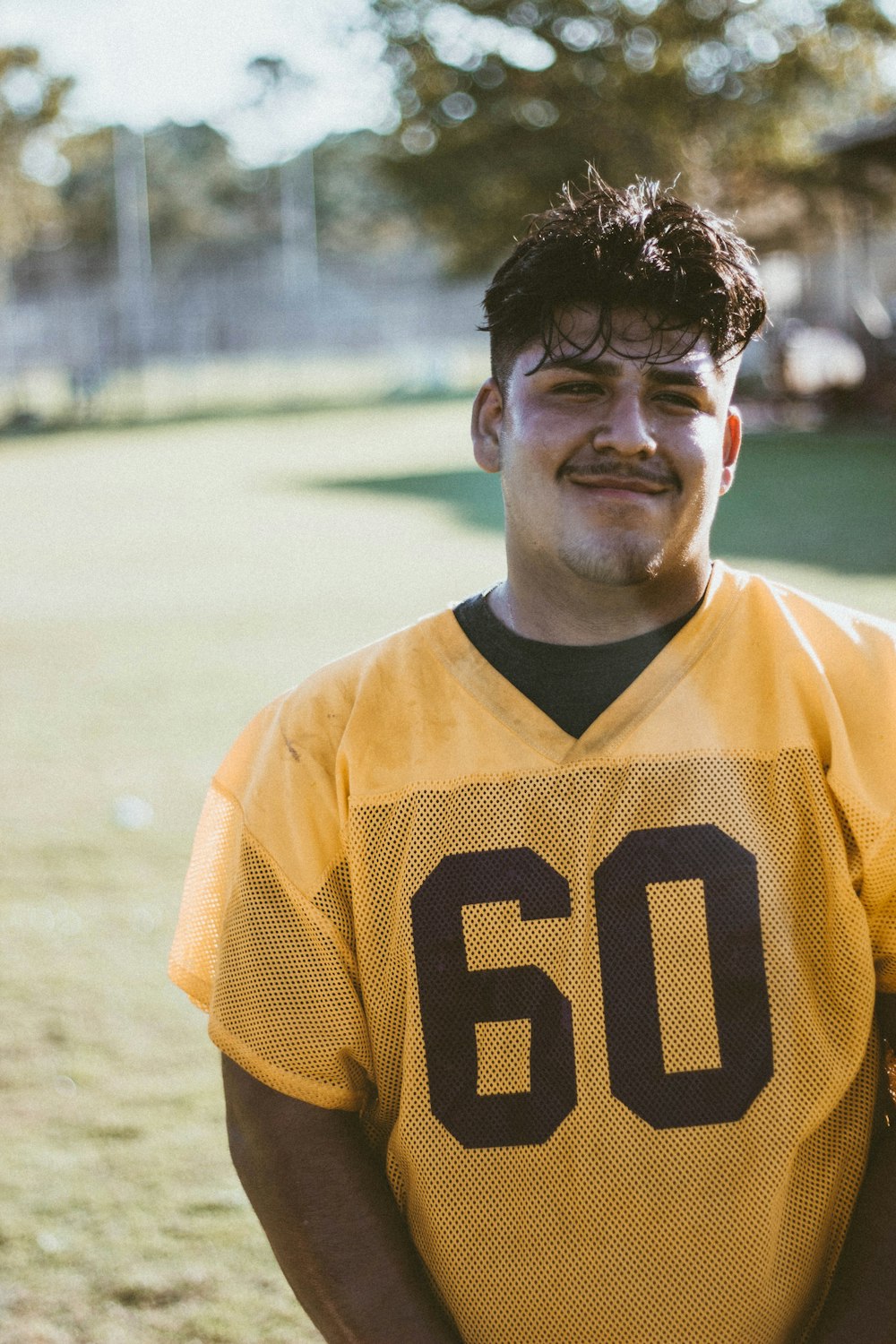 selective focus photo of man in 60 jersey