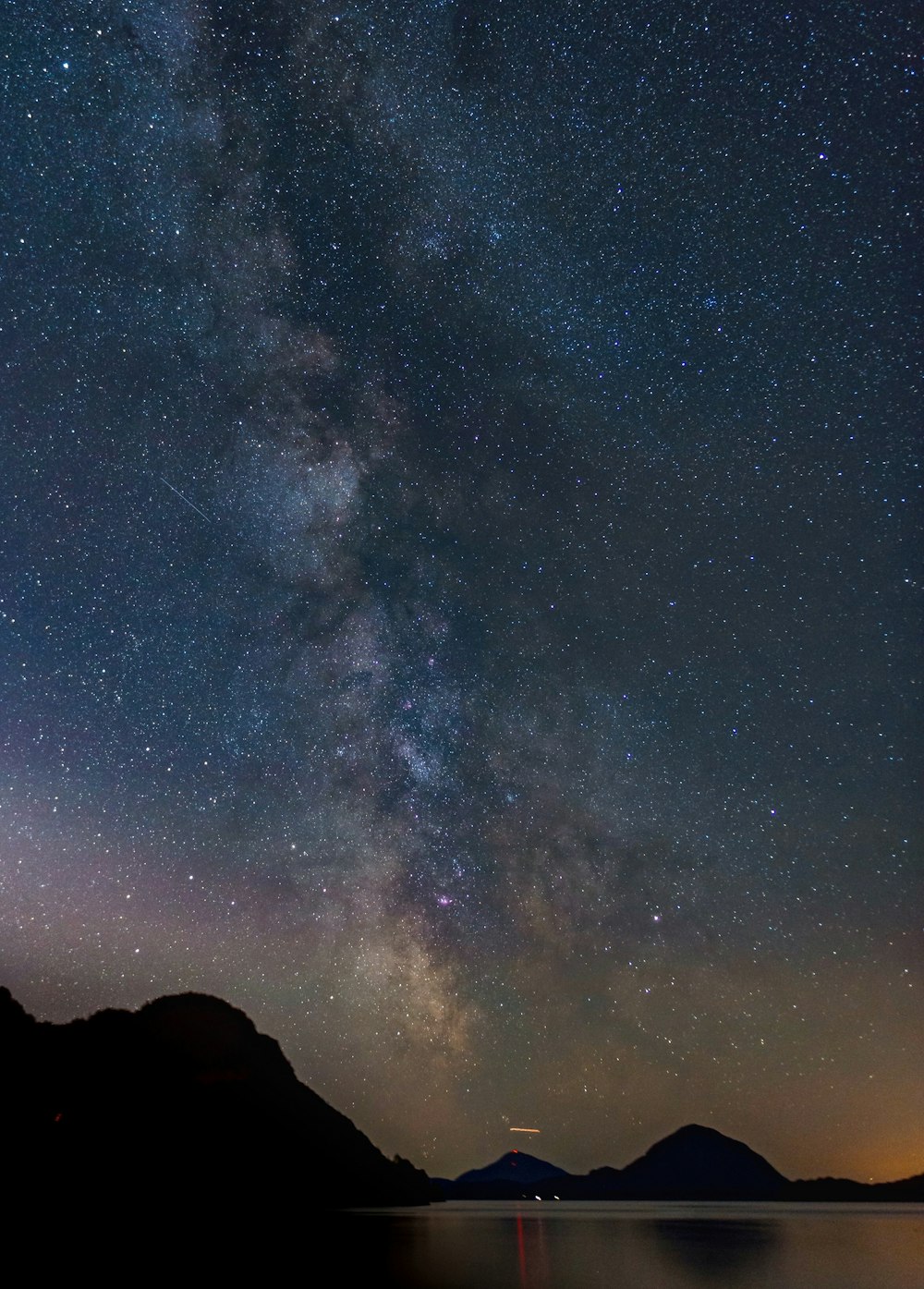 mountain silhouette during night time